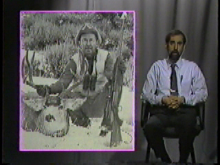 A hunter proudly posing by his victim