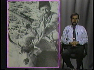 A hunter posing with the animal he killed