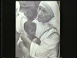 Mother Theresa holding a baby