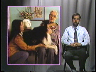 An elderly man petting a dog