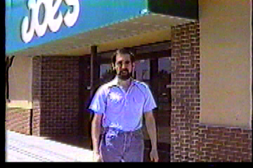 Standing in front of a sporting goods store