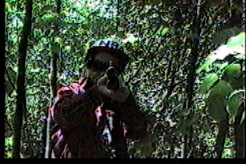 Hunter with gun pointed at Steve