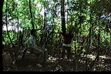 Hunter with gun pointed at Steve