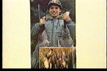 Boys holding up animals they've killed