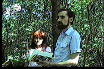 Steve looking up from book in alarm