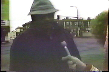 Interviewing a passer-by.