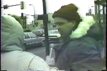 Interviewing a passer-by.